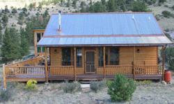 35 acres of solitude surround this mountain home which includes guest quarters (with private bath) and a large greenhouse. Solar system tied to grid for efficient living. 2 bedrooms and 2 baths plus a sunroom and large loft.