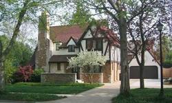 Charming vintage 1929 English Tudor in Ridgedale neighborhood. Completely updated throughout with careful attention to detail of authenticity. Beautiful hardwood flooring and woodwork abound. Kitchen with custom cabinetry, slate tile floor and breakfast