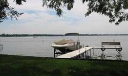 64 feet of fox lk frontage.massive living room w/ full wall of windows four awesome views of lake.brick fireplace, hardwood flooring, oak cabinets, premium granite counters, formal dine,master suite w/ private sitting room over looks lake,master bath w/