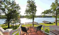 Beautiful waterfront lot with covered boat dock with new roof and enclosed ceiling, new electric Doosie lift and lights, 52x12 deck 2007, all windows and doors w/ Low-E tint replaced in 2011. 2 wood burning fireplaces, one w/ new wood book shelves,
