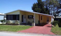 REDUCED! Located in popular Colony Hills a few miles west of Zephyrhills, Florida. This mostly furnished 2 bedroom/2 bath double-wide mobile home will make a comfortable winter retreat or year-round home. It is situated on the southeast corner of the