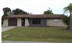 What a bargain! Don't miss this opportunity to get a real deal! This 2 bedroom, 2 bath home features an open plan with spacious kitchen with Corian countertops and blond wood cabinets. Florida room has been enclosed to provide lots of extra space. Home