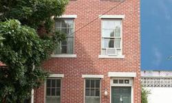 Pristine condition. Bright 3 story brick home located on quiet tree-lined street in the Rittenhouse Square neighborhood. Entry to large living room/dining room with fireplace. Wood floors, brick garden. Lower level totally restored. Gourmet eat-in kitchen