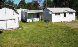 There are a several options here. This property consists a cottage with an open floor plan, full bath, bedroom and another room that could be a small second bedroom or perhaps an office or storage room. There is also a 2 bedroom mobile that is attached to
