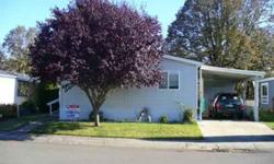 1997 Manufactured home in a nice family park. This home offers three bedrooms, 2 full baths and a separate utility room. 1200 square feet with vaulted ceilings, vinyl windows and forced air heat are some of the extras you will enjoy. Nice open kitchen