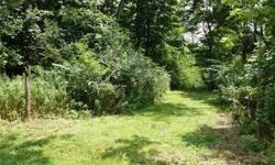 Location supreme - just 1/2 mile access for quick commute of Rt 22/322 bypass. About 1/3 wooded & 2/3 open field/ meadow. 60' wide entrance is part of the 2.18 acres flag shaped lot being conveyed. Small woven wire fence around most of open/ meadow