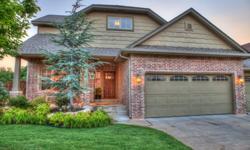 FULL WALK-OUT BASEMENT! Very rare for new construction homes. Beautiful custom home in Canyon Lakes of NW Oklahoma City. This neighborhood features gated entry, walking trails, fishing, community pool/pool house, lakes, wooded greenbelt and is close to