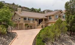 Stunning Contemporary Home Showcases Incredible Views! This is open design at its very best. Elegant & inviting, it frames beautiful mountain & valley views, with sparkling city lights at night. Large deck opens from the living/dining area, & it's all
