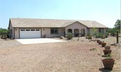 Country home with a split floor plan, 4 bedrooms, office, Arizona room, and 3 baths located on 4 fully fenced acres with a separate 2000 sq ft. workshop that has complete RV hookup. Custom cabinets are installed in kitchen and baths. There is plenty of