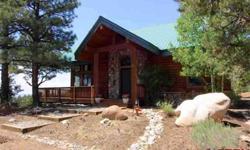 More than a cabin in the woods. This well built charming 1641 sq ft , 2 bedroom home has many upgrades