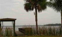 Fabulous double lot on Lake Tarpon open water, with 255 ft, with rip-rap. There is a 66' long dock, including a covered, 7000 lb capacity boat lift. (electric needs to be connected). The open water views are spectacular, and the side of the property sits
