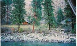 PATENTED & DEEDED GOLD MINE. Inside the USFS River Of No Return Wild & Scenic Area. Idyllic log cabin overlooks the Salmon River. Mining relics tell the tale of this historic, working claim. Access by jetboat from Riggins or Mackay Bar. Airstrip landing