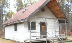 Affordable retreat nestled on a wooded 0.68 acre lot. This 1+ bedroom cabin features newer kitchen cabinetry and all appliances, new furnace and insulation in 2010, tongue and grove cedar walls and ceiling. Great location to Johnson and High Fall Flowages