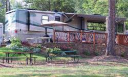 Are you tired of high fuel prices and the continuous work of setting up your campsite time after time? Are you looking for a deeded lot in a secluded community with good neighbors of a mix age group? Then we are looking for you. Lakeshore RV Resort is a