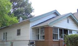 3 Bedroom 1 bath with large front covered porch. unfinished basement, 1 car detached garage and chain link back yard. Currently rented. Great Investment Opportunity OR for Homeowner.