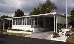 This comfortable and nicely furnished 2 bedroom/2 bath double-wide mobile home is located in Spanish Trails Village in Zephyrhills, Florida. It is move-in ready. So just bring your personal items and begin to enjoy our subtropical climate while your