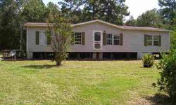 Mobile home on 10 acres of land in the Deweyville ISD, property is located just inside of Newton County but has Orange mailing address. NIce acreage with large trees, very private in a Country atmosphere still close enough to the City. Kitchen offers an