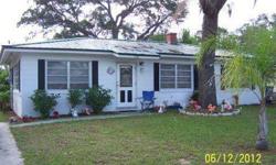 THIS IS GOOD PLACE TO LIVE. HAS A METAL ROOF, FAMILY ROOM NEXT TO THE LIVING ROOM AND OPEN KITCHEN. 2 BEDROOM 1 BATH, INSIDE LAUNDRY ROOM AND ENCLOSED BACK PORCH. THE FLOORS ARE TERRAZZO WELL KEPT. CEILING FANS AND SOME INTERIOR DOORS WERE UPDATED.