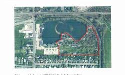 7.8+- acres of wooded residential or commercial land with lake frontage. Located behind "The Landings" office park Traffic count is 11,390 vehicles per day. Taxes are an estimate.Listing originally posted at http