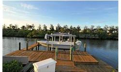 Enjoy glorious water views & breathtaking blend of native tropical plantings from the private secluded backyard of this wonderful waterfront pool home. This waterfront home comes with private wrap around dock & 7k lift with deep water access. Mins to