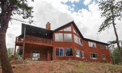 Spectacular CUSTOM WALKOUT RANCHER on 4.36 treed acres BORDERING BLM & overlooking Rainbow Valley. Stunning design features vaulted GREAT ROOM with HARDWOOD FLOORS, STONE FIREPLACE & floor to ceiling windows to enjoy 180 degree MOUNTAIN VIEWS! MAIN LEVEL