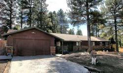 This home sits on a beautiful lot with mature Ponderosa Pine trees. This house has lots of room and is all one level. The perimeter of the house is fully fenced. There are 2 out buildings with electricity that can be used for a workshop, storage area or