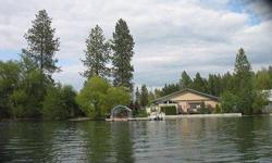 Over 180 feet of Loon Lake waterfront. Two parcels. Low maintenance home has two bedrooms and one bath. Shop is located on second parcel. Includes dock and your own boat launch. A true compound for year round lake living. Paved access from driveway to