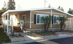 Spacious 2 Bedroom/2 Bathroom Double Wide Mobile Home inside the quiet gated community of Diamond Bar Estates. The park includes a clubhouse with billard tables, kitchen, heated pool and jacuzzi, great for entertaining! There is even a playground for the