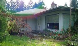 Over 2000 square feet of fixer upper, priced to sell. Lots of potential here! Large covered carport, outbuildings all on over 1/2 Acre. The home does have a fireplace and large rooms and sits on a quiet dead end road. This property is on City Sewer and