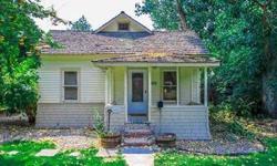 I am a friendly little house in need of a little TLC! For Mr. Fix-it, this house has instant sweat equity built in. Tons of storage in the kitchen. The enclosed back porch is a great way to enjoy the outdoors in all weather! The well-shaded backyard would