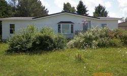 This is a great piece of land with a 2 bed and 2 bath home. Close to 10 acres and a good sized pole barn. Lots of space - perfect for individuals looking for a home in the area! We offer Special Financing for the purchase of this property. ANY credit and
