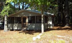 Cabin on The Choctawatchee River In Florida. Furnished 2 bedroom cabin for sale. Has a screened in porch with vinyl siding. 780 sq ft. Walking distance of boat ramp. Located between Ebro and Panama City Florida, at Simplers Fish Camp in Bruce FL 32455.