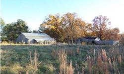 Beautiful Mini Farm on 16 acres with large barn with two lean-to's, pasture, garden area and large wooded tract. NEW METAL ROOF! Three bedrooms, Two baths with wood burning stove in family room. The barn has a concrete floor and measures 30x40 each