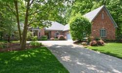 Custom built all brick ranch on wooded 1 acre lot. Basement is finished w/ massive amounts of storage space. Great room w/15 ft ceiling and bank of windows that overlook private backyard, Formal DR w/tray ceiling, Library w/floor to ceiling cherry