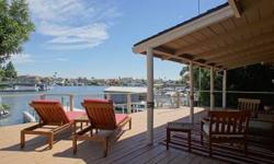 Relax on your deck with a southeastern exposure overlooking Indian Bay, one of the best bays in the area. This home has a deep water dock and is minutes from fast water. The remodeled kitchen has Colori Italian tile countertops, skylights, wood laminate