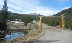 True Alpine Mountain living at its finest! A mere 7.8 miles from the entrance to Big Sky, this large 39 acre mature treed lot backs to Gallatin National Forest and has top of the world views. Located behind a gated community, this special subdivision