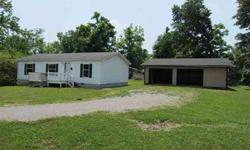 In town but located on a spacious lot, this 3BR, 2BA home plus pole barn is just the right place. Open, airy split floor plan with cathedral ceilings, eat-in kitchen and counter space, large lot, plus spacious 32'x30' pole barn for your toys. Master has