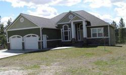 4400 sq ft 5 bedroom 3 bath rancher on 10 view acres. Custom touches throughout. Granite and hardwoods. Coved ceilings with inset lighting in the formal dining room and master bedroom. The main floor master suite has a private bath, walk-in closet and