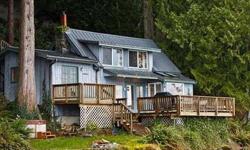Relax and feel the peace of living right on the lake. Fish from the deck! A hideaway with 2 full bedroom that isn't far from the rest of the world, it just feels like it. Among the fragrant trees, along the beauty of Lake Whatcom, feel the sand beneath