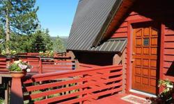 This three bedroom two bath Tahoe cabin has decks and windows galore to drink in views of the Sierras! Relax in the privacy of your home just steps from acres of recreation lands. New carpet & paint make this cabin move in ready. Bring your toys and start
