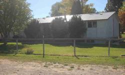 Just west of Blackfoot, nice small hobby farm with about 1,800 feet of frontage on the Snake River. Complete farmstead with three bedroom, full basement residence, 2-car attached garage, and several supporting outbuildings. Irrigated cropland has been