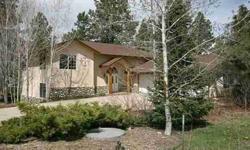Beautiful 3 bedroom, 3.5 bath home on a 1 acre lot in Durango West II. A gorgeous tiled entry leads you in to this wonderful home. The living room features a cathedral ceiling, a wall of windows capturing the serenity of the woods, and a gas fireplace