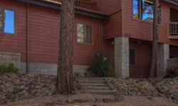 Very private upscale rustic contemporary home for sale in tall pines in Hidden Valley Ranch near historic downtown Prescott, AZ, bordering National Forest w/views of mountains & trees from decks & patio. Extensively upgraded w/warm, natural finishes,