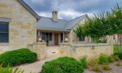 This picture perfect Hill Country Home has a private enclosed courtyard entry and sits on approximately 1/2 acre. The Great Room has high vaulted beamed ceilings, gleaming wood floors, a rock fireplace, and built in shelving for media and books. The