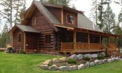 Great Northern Pine Log home on 5 treed & parked out acres with mountain views. High end construction includes granite, imported tile from Italy, stainless steel appliances, log railings and central air. 40x60 shop with horse stalls. Professionally