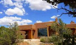 Juniper Moon Realty, LLC 505.850.2960 The Enchanted Garden Home! This gorgeous custom pueblo built by JC Anderson Construction has stunning views from every vantage point! It is beautifully landscaped and situated on 20.03 acres in one of the prettiest