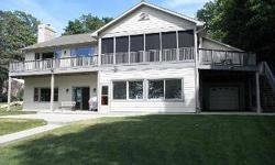 Waterfront!! Walk-out ranch set on 153' of Lake Winnebago frontage 20 minutes from Valley. Open concept floor plan, upper level screened porch, decking, lower level 3-seasons room, patio, and clubhouse located over boathouse give a variety of options to