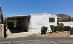 LILY PIGG & MOBILE HOME CONNECTION PRESENT...Completely refurbished home with luxurious details.The views from this home are incredible! Large view lot in excellent location within this community. Beautiful kitchen with all appliances included. Wood