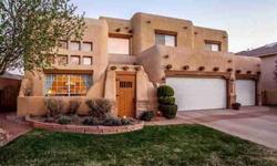 Mountain and city views!Custom southwest Santa Fe style home backs to Bear Canyon open space. Enclosed courtyard. Grand entry hall.Dramatic family room flooded with light with soaring wood celing, vigas, latillas and impressive kiva fireplace.Expansive