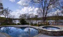 Overlooking the Main Channel of Badin Lake, this 3 level home features a Stone Fireplace, Hardwood Flooring, 2 Master En-suites. Several Terraces that overlook a Lakeside Oasis. --including a heated in ground pool, Outdoor Spa & Private Pier with a